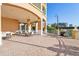 Outdoor patio area with dining tables and a grill for outdoor cooking at 700 N Osceola Ave # 504, Clearwater, FL 33755