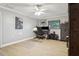 Comfortable bedroom with a modern ceiling fan and a desk for a quiet workspace at 7439 Lake Forest Cir, Port Richey, FL 34668