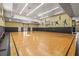 Spacious indoor basketball court with painted mural and ample lighting for recreational activities at 10115 Courtney Palms Blvd # 202, Tampa, FL 33619