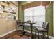Cozy community dining area with a stylish table and chairs, perfect for casual meals or meetings at 10115 Courtney Palms Blvd # 202, Tampa, FL 33619