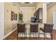 Community kitchen bar featuring modern appliances, a marble counter, and bar stool seating at 10115 Courtney Palms Blvd # 202, Tampa, FL 33619