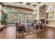 Welcoming community lounge with a stone fireplace, plush seating, and views of the surrounding landscape at 10115 Courtney Palms Blvd # 202, Tampa, FL 33619