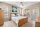Bright bedroom with large windows, neutral walls, and plank flooring at 10115 Courtney Palms Blvd # 202, Tampa, FL 33619