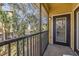 Private screened patio with views of the lush landscaping, offering a serene and relaxing outdoor space at 10115 Courtney Palms Blvd # 202, Tampa, FL 33619
