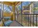 Relaxing screened patio with table and chairs provides a peaceful outdoor retreat overlooking the community at 10115 Courtney Palms Blvd # 202, Tampa, FL 33619