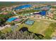 Aerial shot of community sports area, including tennis courts, pools, and recreational facilities at 10947 Cory Lake Dr, Tampa, FL 33647