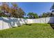 Well-maintained backyard featuring lush green grass and a privacy fence, great for outdoor activities at 11492 60Th Lane, Pinellas Park, FL 33782