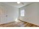 This bedroom features a window for natural light and wood-look flooring at 11492 60Th Lane, Pinellas Park, FL 33782