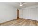 Bedroom showcasing hardwood floors, ceiling fan, and closet space at 11492 60Th Lane, Pinellas Park, FL 33782