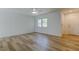 Bright bedroom with light wood floors, a ceiling fan, and a view to the outdoors at 11492 60Th Lane, Pinellas Park, FL 33782