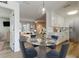 Bright, open dining area showcasing modern table set and easy access to the kitchen and living room at 11492 60Th Lane, Pinellas Park, FL 33782