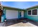 Charming home featuring a one-car garage, colorful landscaping, and a welcoming front entrance at 11492 60Th Lane, Pinellas Park, FL 33782