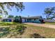 Inviting home with vibrant landscaping, a well-kept lawn, and a spacious driveway at 11492 60Th Lane, Pinellas Park, FL 33782