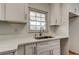 Updated kitchen featuring white cabinets, granite countertops, and stainless steel hardware at 11492 60Th Lane, Pinellas Park, FL 33782