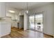 Bright, white kitchen featuring white cabinets and stainless appliances, with a view of the pool at 11492 60Th Lane, Pinellas Park, FL 33782