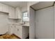 White cabinets, granite countertops, and stainless steel sink in the kitchen at 11492 60Th Lane, Pinellas Park, FL 33782