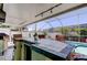 This backyard features an outdoor kitchen with a bar, perfect for entertaining friends and Gathering at 11492 60Th Lane, Pinellas Park, FL 33782