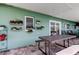 Inviting covered patio with outdoor dining area, potted plants, and easy access to the home's interior at 11492 60Th Lane, Pinellas Park, FL 33782