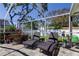 Comfortable screened patio featuring lounge chairs and seating area, creating an ideal outdoor space to relax and unwind at 11492 60Th Lane, Pinellas Park, FL 33782