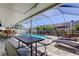 The screened in pool and patio area with a fountain and covered seating at 11492 60Th Lane, Pinellas Park, FL 33782