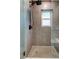 Shower with modern tile work and a rainfall shower head at 11492 60Th Lane, Pinellas Park, FL 33782