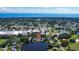 An aerial view highlighting the home's desirable location on a pond in a quiet neighborhood at 1163 60Th S Ave, St Petersburg, FL 33705