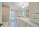 Updated bathroom featuring granite countertops, modern fixtures, and ample cabinet space at 1163 60Th S Ave, St Petersburg, FL 33705