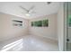 Bright bedroom with terrazzo flooring, natural light, and a ceiling fan at 1163 60Th S Ave, St Petersburg, FL 33705