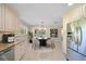 Eat-in kitchen featuring stainless steel appliances, granite counters and adjacent dining area at 1163 60Th S Ave, St Petersburg, FL 33705