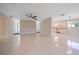 Large living area offering tile floors, neutral tones, and an open layout to the kitchen at 1163 60Th S Ave, St Petersburg, FL 33705