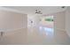 Spacious, airy living room with shiny floors and a seamless flow to other living areas at 1163 60Th S Ave, St Petersburg, FL 33705