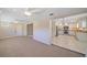 Bright living room flows into an updated kitchen with modern appliances and granite countertops at 1163 60Th S Ave, St Petersburg, FL 33705