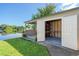 Outdoor shed with open doors, offering lake views, storage, and a small, covered porch at 1163 60Th S Ave, St Petersburg, FL 33705