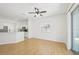 Room featuring wood-look tile flooring, view to kitchen and glass sliding doors at 1217 Alhambra Crest Dr, Ruskin, FL 33570