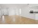 Spacious living room with wood-look tile flooring and white walls at 1217 Alhambra Crest Dr, Ruskin, FL 33570