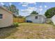 Backyard featuring a wooden fence, exterior shed, and the back of the house at 1260 S Hillcrest Ave, Clearwater, FL 33756