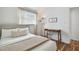 Well-designed bedroom with desk workspace, hardwood floors, and cozy queen bed at 1260 S Hillcrest Ave, Clearwater, FL 33756