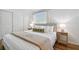 Well-lit bedroom includes closet, queen size bed, and stylish bedside tables at 1260 S Hillcrest Ave, Clearwater, FL 33756