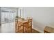 Bright dining area with wood table and chairs, flowing to outdoor patio view at 1260 S Hillcrest Ave, Clearwater, FL 33756