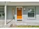 Inviting front door featuring stylish tile flooring, seating, and a welcoming entryway to the home at 1260 S Hillcrest Ave, Clearwater, FL 33756