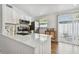 Updated kitchen with stainless steel appliances and patio access provides modern comfort at 1260 S Hillcrest Ave, Clearwater, FL 33756