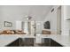 Kitchen island view showing modern faucet, stainless sink, and open concept layout to the living room at 1260 S Hillcrest Ave, Clearwater, FL 33756