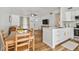 Charming living space seamlessly connects the kitchen, dining area, and living room at 1260 S Hillcrest Ave, Clearwater, FL 33756