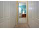 Bright bathroom featuring double vanity, soaking tub, and tile flooring through doorway at 1308 Crystal Greens Dr, Sun City Center, FL 33573