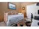 Bedroom with twin daybed, brown walls, and white closet doors at 1308 Crystal Greens Dr, Sun City Center, FL 33573