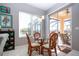 Charming breakfast nook with a glass table, rattan chairs and a view of the pool area at 1308 Crystal Greens Dr, Sun City Center, FL 33573