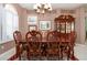 A dining room featuring a dark wood table with seating for six at 1308 Crystal Greens Dr, Sun City Center, FL 33573