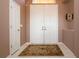 Bright foyer featuring white tile flooring and a decorative area rug at 1308 Crystal Greens Dr, Sun City Center, FL 33573