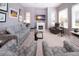 Inviting living room with a fireplace, comfortable seating, and plenty of natural light at 1308 Crystal Greens Dr, Sun City Center, FL 33573