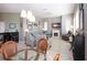 Comfortable living room with a fireplace, and stylish furniture adjacent to the breakfast nook at 1308 Crystal Greens Dr, Sun City Center, FL 33573